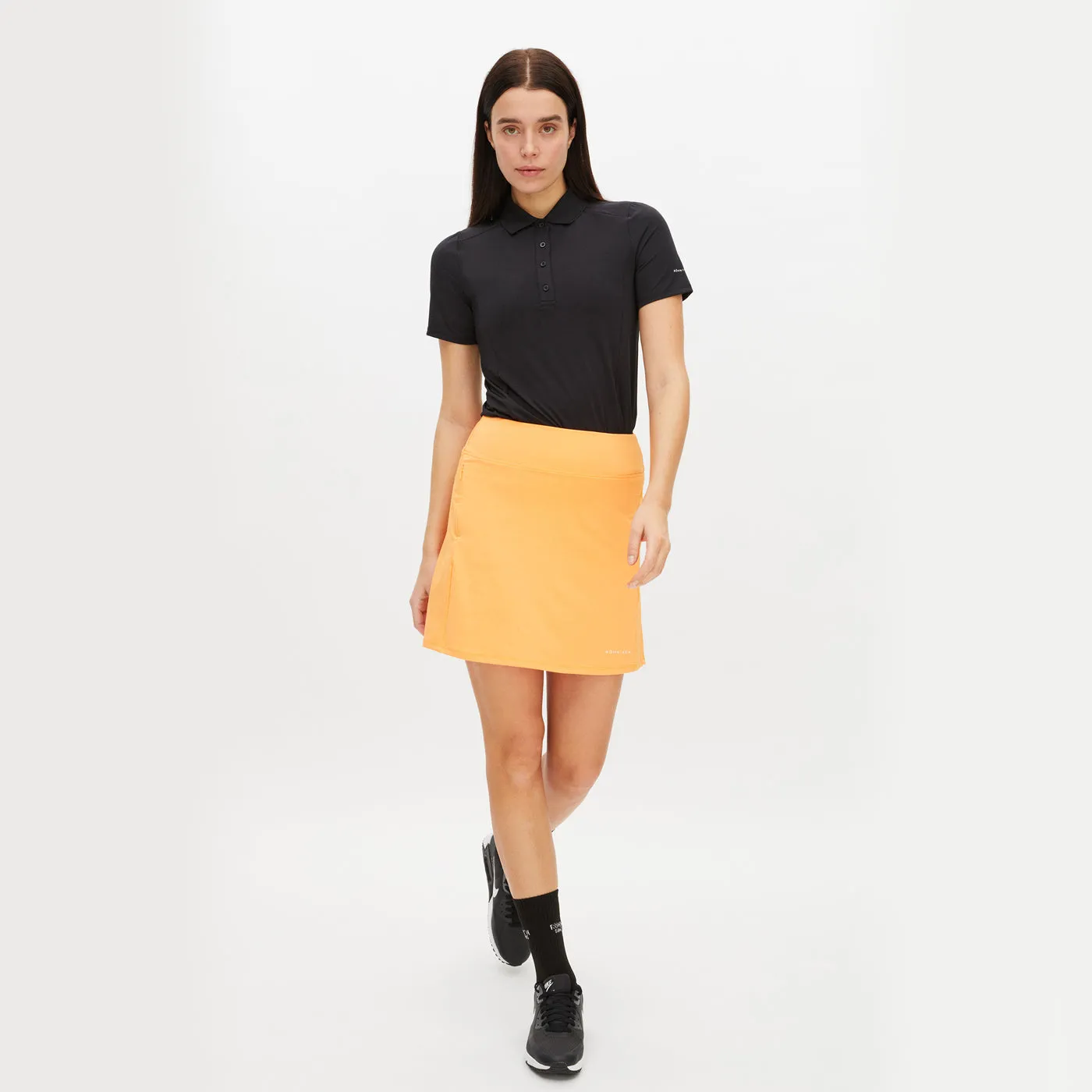 Rohnisch Women's Rumie Golf Skort - Blazing Orange Texture Shot