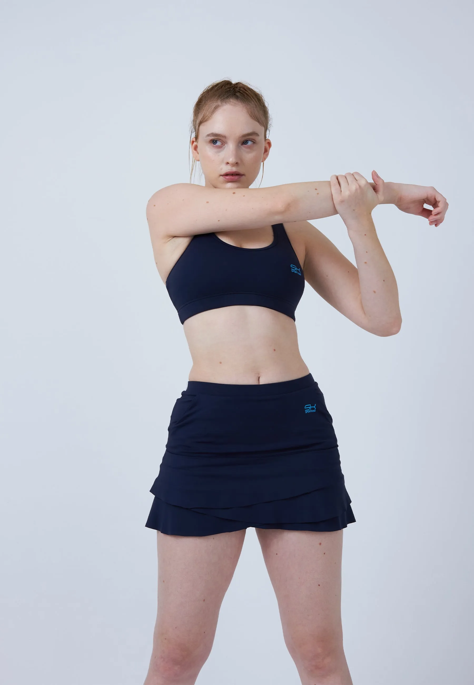 Draped Silhouette Tulip Tennis Skort with pockets, navy blue