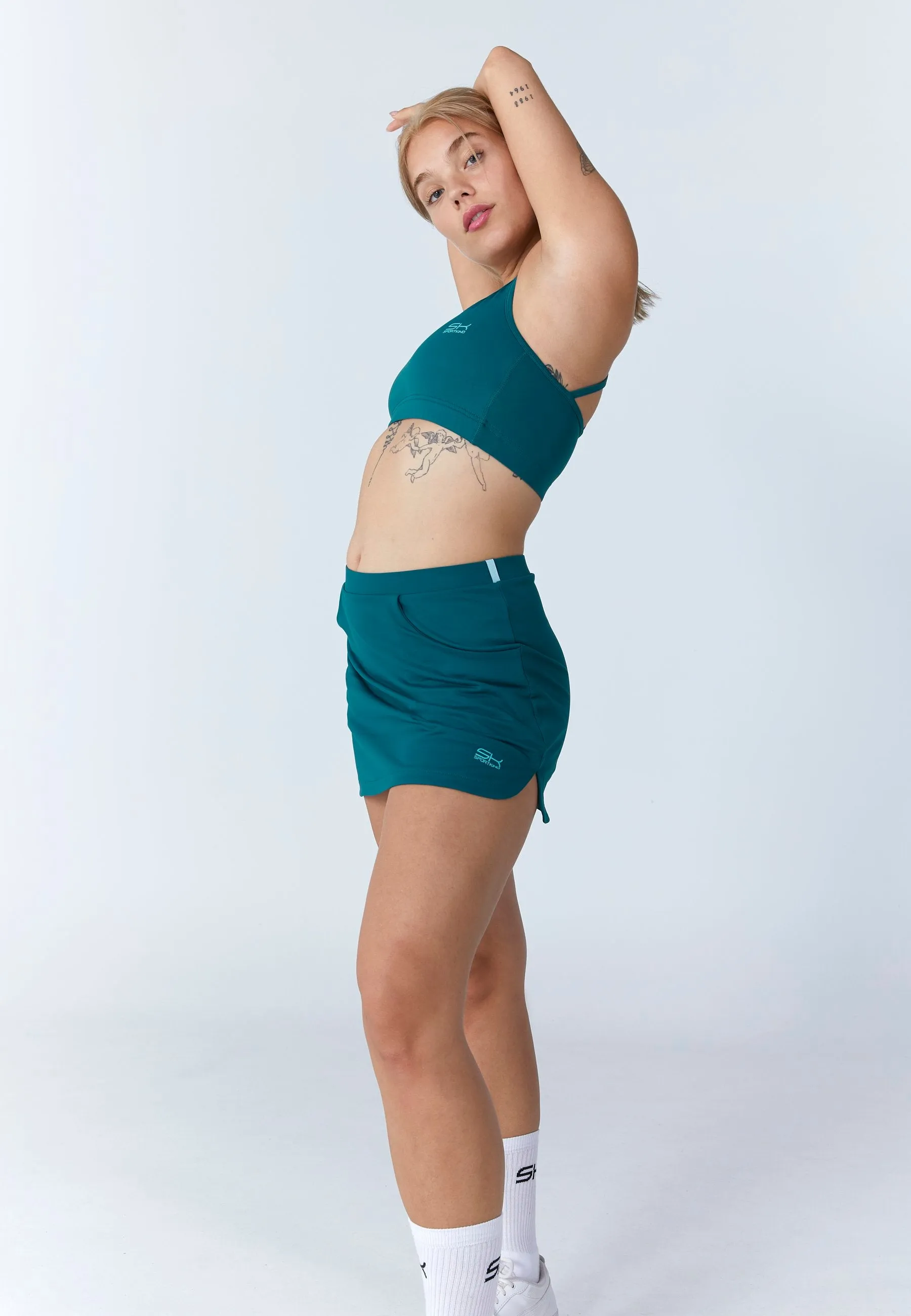 Smooth Motion Design Detail Classic Tennis Skort with pockets, dark teal
